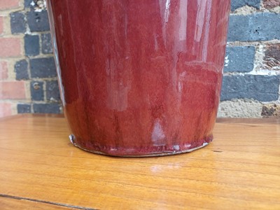 Lot 37 - A rare and very large Chinese copper red-glazed 'Langyao' rouleau vase, Qing dynasty, Kangxi period