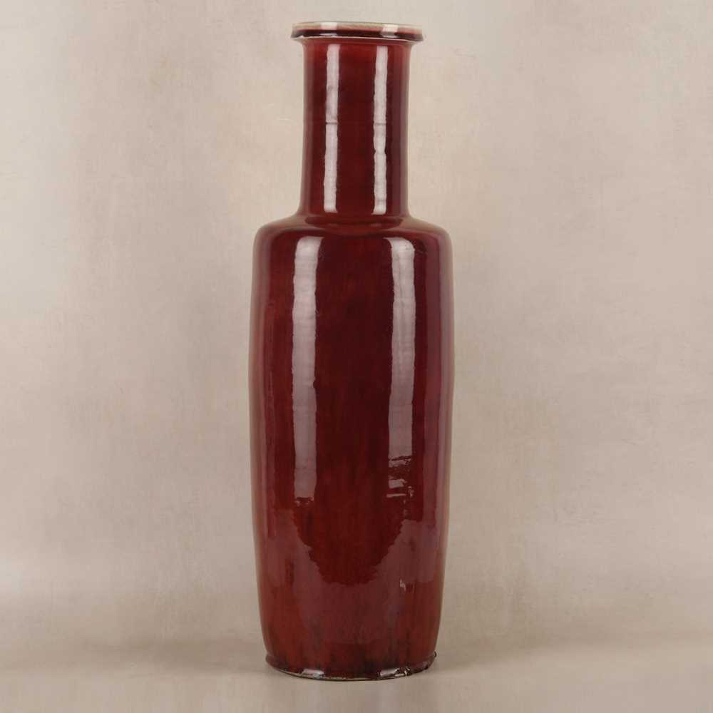 Lot 37 - A rare and very large Chinese copper red-glazed 'Langyao' rouleau vase, Qing dynasty, Kangxi period