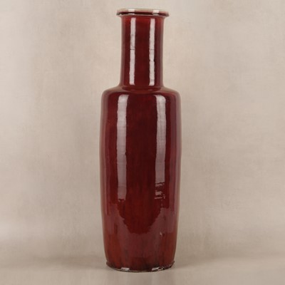 Lot 37 - A rare and very large Chinese copper red-glazed 'Langyao' rouleau vase, Qing dynasty, Kangxi period