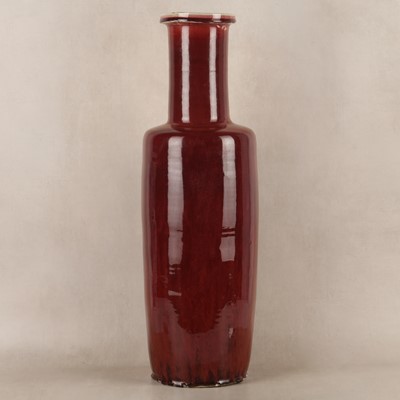 Lot 37 - A rare and very large Chinese copper red-glazed 'Langyao' rouleau vase, Qing dynasty, Kangxi period