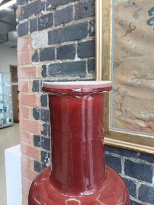 Lot 37 - A rare and very large Chinese copper red-glazed 'Langyao' rouleau vase, Qing dynasty, Kangxi period