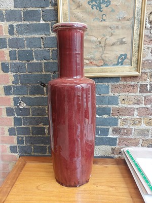 Lot 37 - A rare and very large Chinese copper red-glazed 'Langyao' rouleau vase, Qing dynasty, Kangxi period