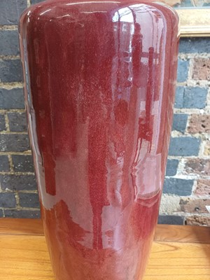 Lot 37 - A rare and very large Chinese copper red-glazed 'Langyao' rouleau vase, Qing dynasty, Kangxi period