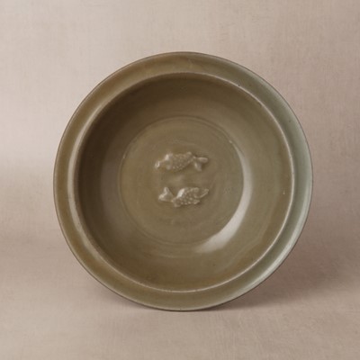 Lot 462 - A Chinese Longquan celadon 'twin fish' moulded dish, Ming dynasty