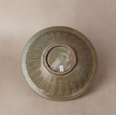 Lot 462 - A Chinese Longquan celadon 'twin fish' moulded dish, Ming dynasty