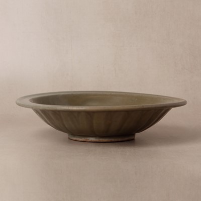 Lot 462 - A Chinese Longquan celadon 'twin fish' moulded dish, Ming dynasty