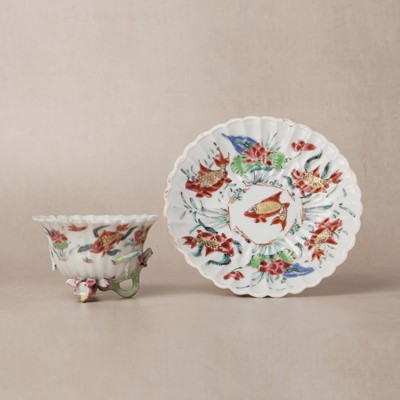 Lot 163 - A Chinese export famille-rose 'carp and lotus' cup and saucer, Qing dynasty, Yongzheng period