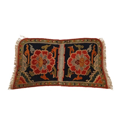 Lot 592 - A Tibetan 'floral' saddle rug, 19th/20th century