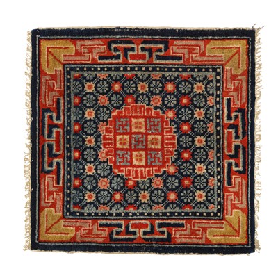 Lot 591 - A Tibetan 'temple' square rug, 19th/20th century