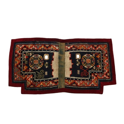 Lot 593 - A Tibetan 'floral' saddle rug, 19th/20th century