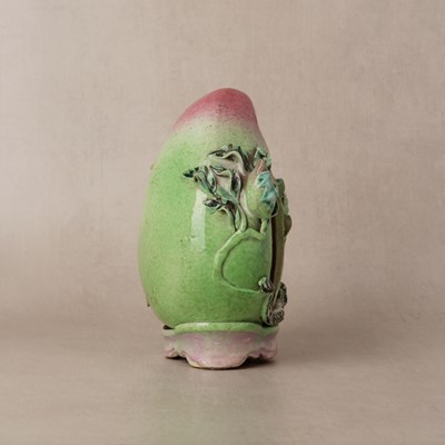 Lot 49 - A Chinese famille-rose 'shoulao' peach figure, Qing dynasty, 19th century