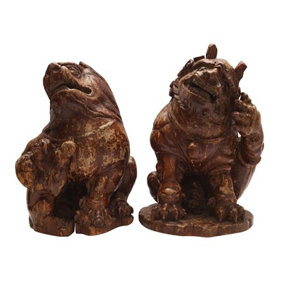 Lot 398 - Two Chinese carved wood lion dogs, Qing dynasty, 19th century