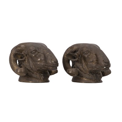 Lot 62 - A pair of French Empire style patinated bronze ram’s head sculptures