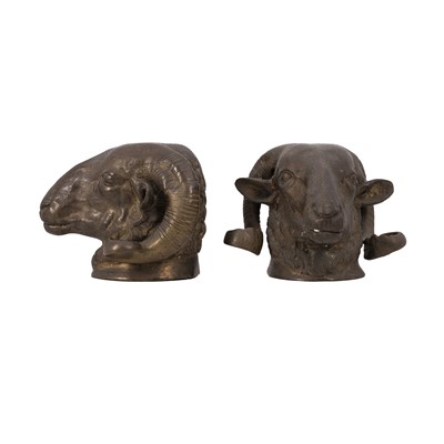 Lot 62 - A pair of French Empire style patinated bronze ram’s head sculptures