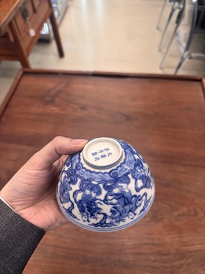 Lot 61 - A Chinese blue and white 'Eight Daoist Immortals' bowl, Qing dynasty, Tongzhi period
