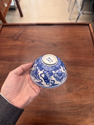 Lot 61 - A Chinese blue and white 'Eight Daoist Immortals' bowl, Qing dynasty, Tongzhi period