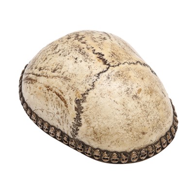 Lot 588 - A Tibetan silver-mounted skull cap, kapala, 19th century