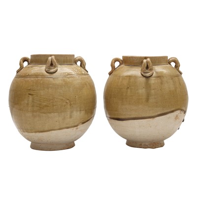 Lot 680 - A pair of Chinese celadon-glazed jars, Sui/Tang dynasty