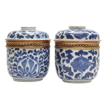Lot 620 - Two Chinese blue and white 'lotus scroll' pots and covers, Qing dynasty