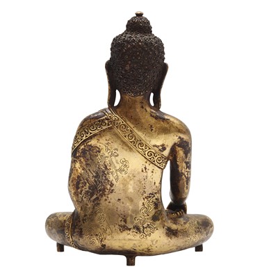 Lot 502 - A Nepalese gilt-bronze figure of Buddha Shakyamuni, 18th/19th century