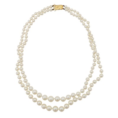 Lot 416 - A double strand pearl necklace, circa 1972