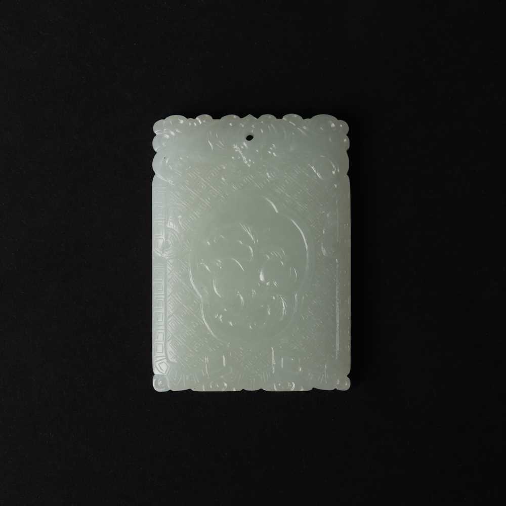 Lot 538 - A Chinese jade 'double peach' plaque, 19th/20th century
