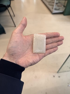 Lot 538 - A Chinese jade 'double peach' plaque, 19th/20th century
