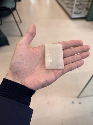 Lot 538 - A Chinese jade 'double peach' plaque, 19th/20th century
