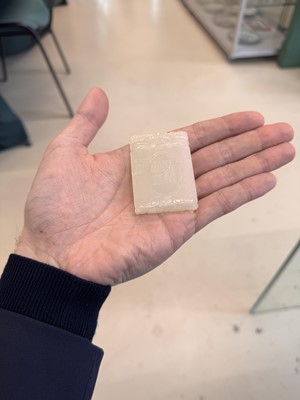 Lot 538 - A Chinese jade 'double peach' plaque, 19th/20th century