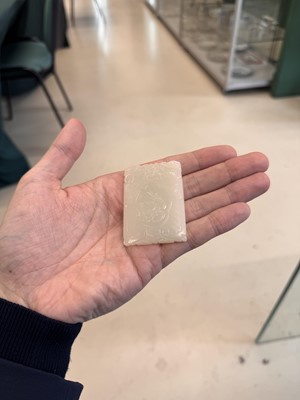 Lot 538 - A Chinese jade 'double peach' plaque, 19th/20th century