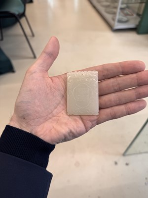 Lot 538 - A Chinese jade 'double peach' plaque, 19th/20th century