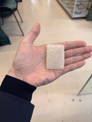 Lot 538 - A Chinese jade 'double peach' plaque, 19th/20th century