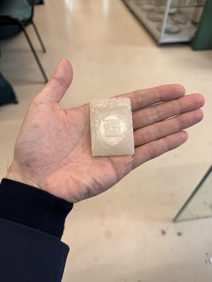 Lot 538 - A Chinese jade 'double peach' plaque, 19th/20th century