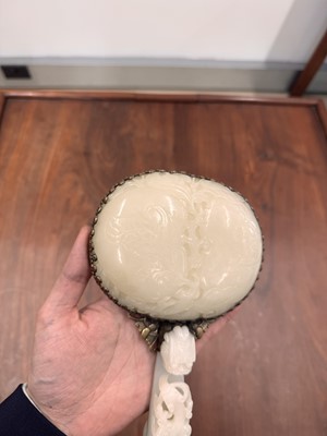 Lot 110 - A fine Chinese white jade plaque and belt hook, Qing dynasty, 18th century