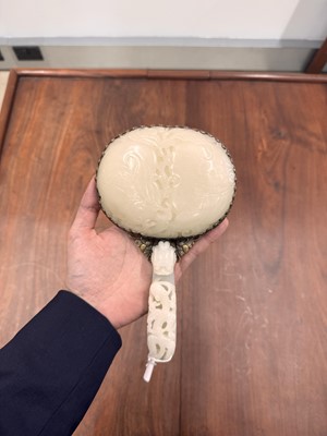 Lot 110 - A fine Chinese white jade plaque and belt hook, Qing dynasty, 18th century