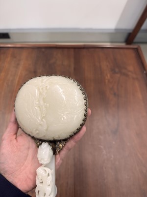 Lot 110 - A fine Chinese white jade plaque and belt hook, Qing dynasty, 18th century