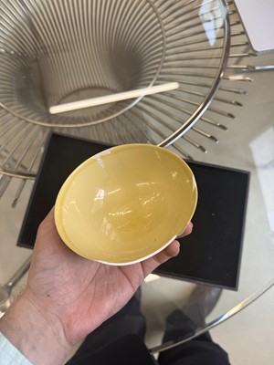 Lot 29 - A Chinese Imperial monochrome yellow-glazed bowl, Qing dynasty, Kangxi mark and of the period