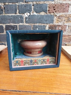Lot 28 - A partial Chinese Imperial peachbloom-glazed brush washer, Qing dynasty, Kangxi mark and period