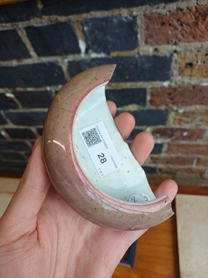 Lot 28 - A partial Chinese Imperial peachbloom-glazed brush washer, Qing dynasty, Kangxi mark and period