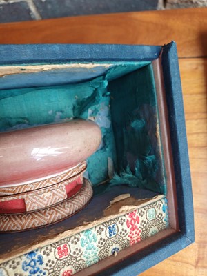 Lot 28 - A partial Chinese Imperial peachbloom-glazed brush washer, Qing dynasty, Kangxi mark and period