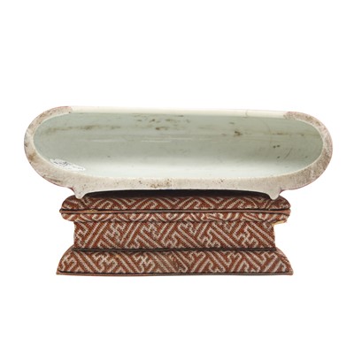 Lot 28 - A partial Chinese Imperial peachbloom-glazed brush washer, Qing dynasty, Kangxi mark and period