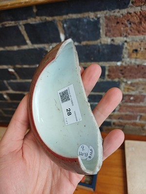 Lot 28 - A partial Chinese Imperial peachbloom-glazed brush washer, Qing dynasty, Kangxi mark and period