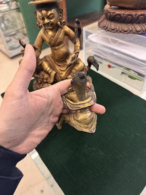 Lot 504 - A Tibetan bronze figure of Jambhala with consort, 20th century