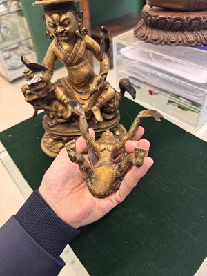 Lot 504 - A Tibetan bronze figure of Jambhala with consort, 20th century
