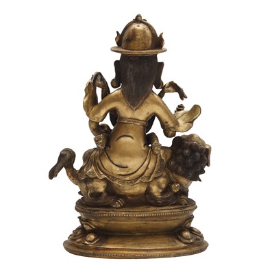 Lot 504 - A Tibetan bronze figure of Jambhala with consort, 20th century