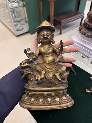 Lot 504 - A Tibetan bronze figure of Jambhala with consort, 20th century
