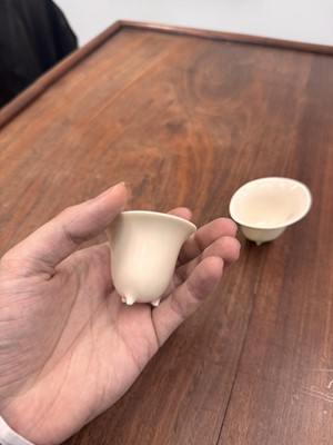 Lot 90 - Two Chinese Dehua inscribed cups, Qing dynasty, 17th/18th century