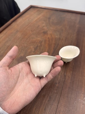 Lot 90 - Two Chinese Dehua inscribed cups, Qing dynasty, 17th/18th century