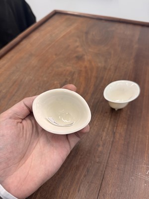 Lot 90 - Two Chinese Dehua inscribed cups, Qing dynasty, 17th/18th century