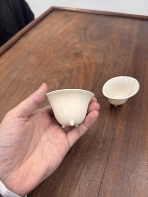 Lot 90 - Two Chinese Dehua inscribed cups, Qing dynasty, 17th/18th century